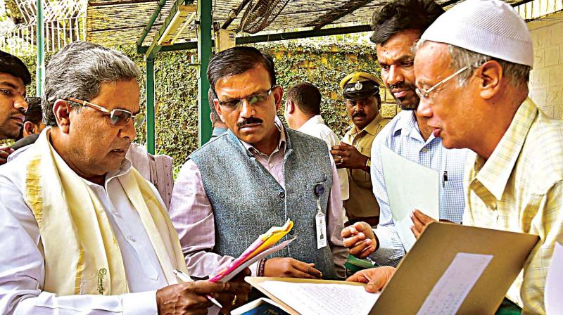 Chief Minister Siddaramaiah listens to public grievances at Krishna, his home office in Bengaluru on Monday.