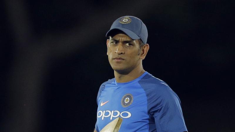 In a video posted by Kolkata Police on their Facebook page, MS Dhoni is seen aiming with a pistol and firing a couple of rounds. (Photo: AP)