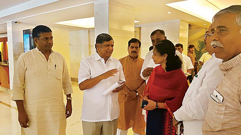 BJP leader Jagadish Shettar with Union agriculture secretary Neeraja Adidam in Bengaluru on Saturday.