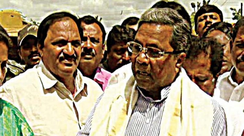 A file photo of Chief Minister Siddaramaiah with his aide Mari Gowda (left).