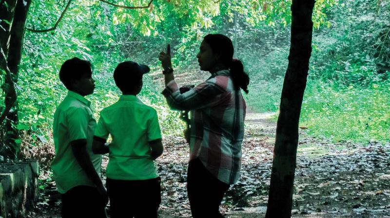 Students of GVHSS Cheruvannur and crew during the shoot of the documentary on groves.