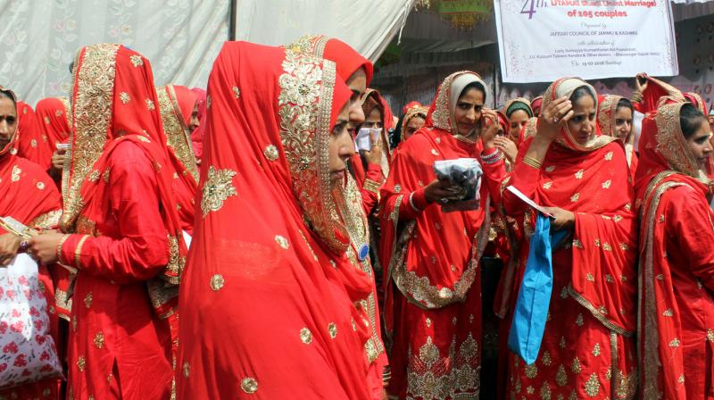 Girls pictured during a mass wedding ceremony.