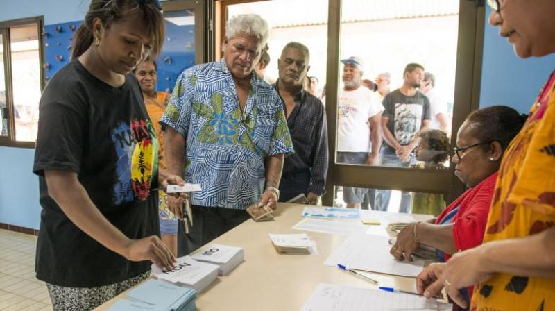People line up at a polling station in Noumea, New Caledonia, as they prepare to cast their votes as part of an independence referendum, on Sunday, November 4, 2018. (Photo: AP)