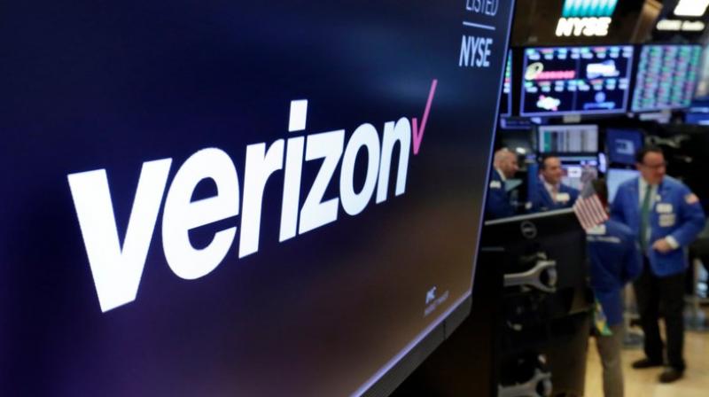 This photo shows the logo for Verizon above a trading post on the floor of the New York Stock Exchange. Using an emerging wireless technology known as 5G, Verizons 5G Home service provides an alternative to cable for connecting laptops, phones, TVs and other devices over Wi-Fi. It launches in four US cities on October 1. (AP Photo/Richard Drew, File)