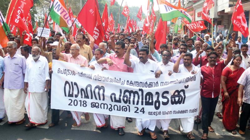 Members of major trade unions taking out a march to Secretariat as part of the motor vehicle bandh, in Thiruvananthapruam on Wednesday. (Photo: G.G. Abhijith)