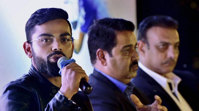 Virat Kohli revealed that even now when he is at the height of his popularity as an international cricketer, one person he is scared of is his childhood coach Rajkumar Sharma. (Photo: PTI)