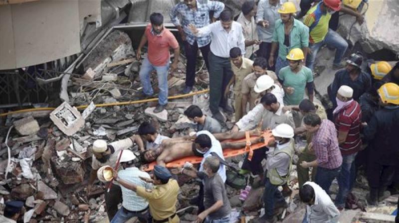 Rescue work in progress after a five storey building collapsed in Mumbai on Thursday. (Photo: PTI)