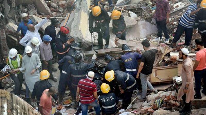 Rescue work in progress after a five storey building collapsed in Mumbai on Thursday. (Photo: PTI)