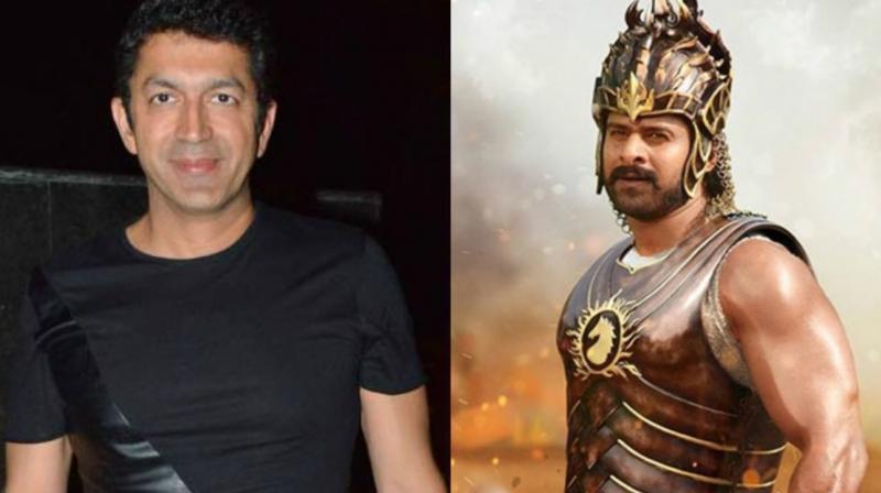 Kunal Kohli and Poster of Baahubali 2