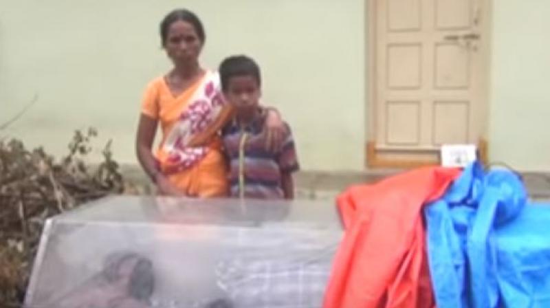 The woman lost her son to dengue. (Photo: Screengrab)