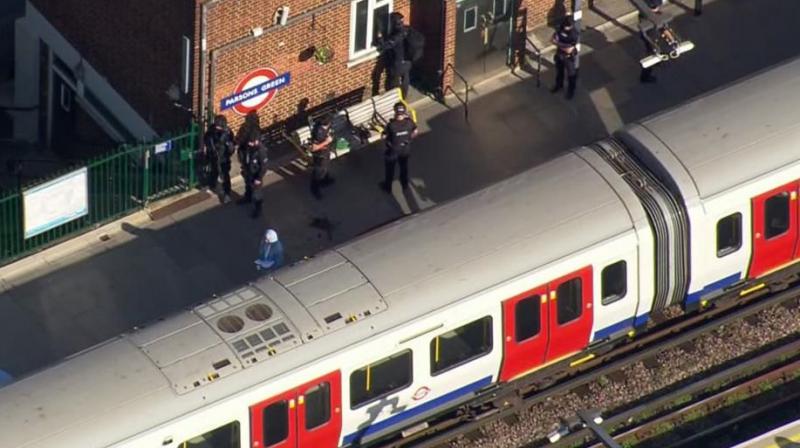 In this aerial image made from video, police officers work at the Parsons Green Underground station after an explosion in London on Friday. (Photo: AP)
