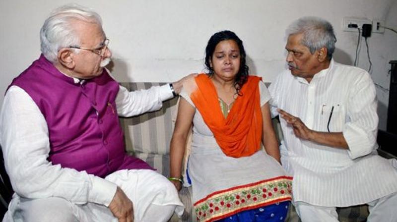 Haryana Chief Minister Manohar Lal Khattar consoling the mother of Pradyumna, the student who was murdered at Ryan International School recently, at Bhondsi in Gurugram on Friday. (Photo: PTI)