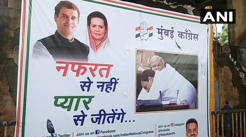 The posters, put by the Congress workers, have a tagline that reads: Nafrat se nahi, Pyar se jeetenge. (Photo: Twitter |