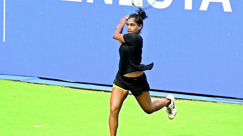 Natasha Palha of Goa plays a shot during the womens singles semifinal against top seed Zeel Desai at the Fenesta Open National Tennis Championship in Delhi on Friday. Natasha won 4-6, 6-4, 6-0.