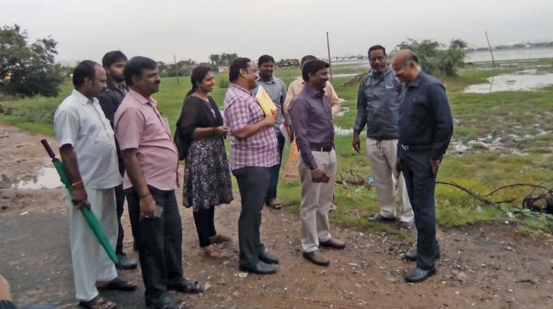 Chennai district collector Shanmughasundaram inspects Korratur, Ambattur and Retteri lakes along with PWD and revenue officials on Friday. 	Image; DC