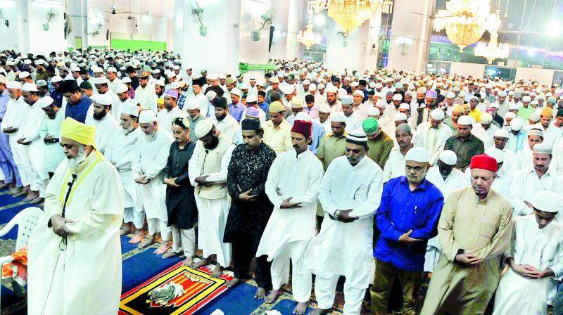 Muslims offer prayers at Macca Masjid in the city to mark Shab-e-Baraat on Thursday. 	(Photo: DC)