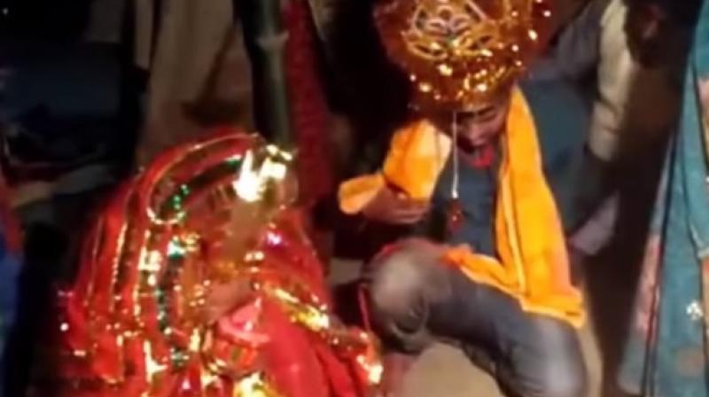 Video clips from the wedding show Vinod Kumar, the forced groom, being thrashed and compelled to perform wedding rituals in Patnas Pandarak area. (Screengrab)