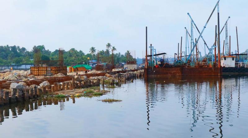 Link road works under progress by filling Ashtamudi Lake.