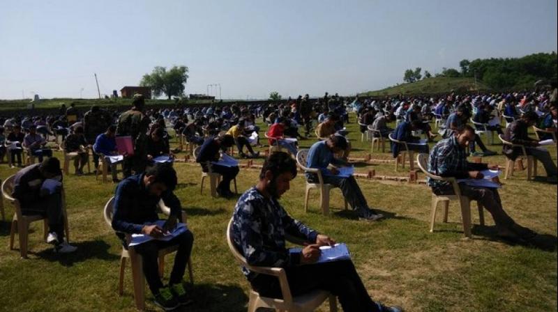 Candidates appear for Common Entrance Written Examination for the selection of Indian Army, in Kashmir. (Photo: Twitter | ANI)