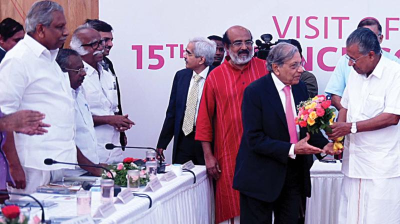 Chief Minister Pinarayi Vijayan welcomes Fifteenth Finance commission chairman N.K. Singh at a sitting with Kerala ministers in Thiruvananthapuram on Monday. Ministers A.C. Moideen, P.K. Raju, Kadannappali Ramachandran and T.M. Thomas Isaac are seen nearby. (Photo: DC)