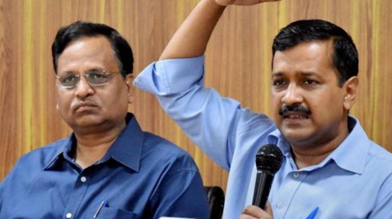 Delhi CM Arvind Kejriwal and Health Minister Satyendra Jain addressing a press conference on issues related to Delhi at his Residence in New Delhi on Saturday. (Photo: PTI)