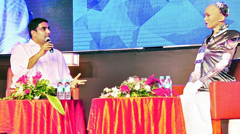 IT minister Nara Lokesh interacts with the worlds first robot citizen Sophia, on Thursday, the concluding day of Vizag Fintech Festival.  (P. naraysimha Murthy)