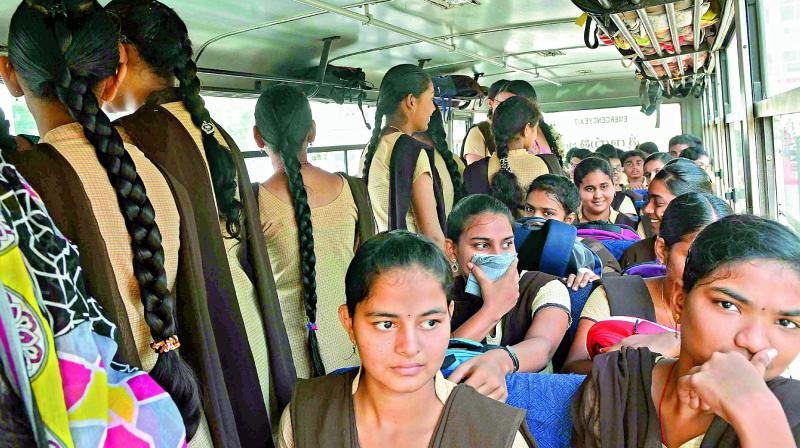 Students forced to travel standing in an overcrowded school bus in Vijayawada on Thursday.  (Deccan chronicle)