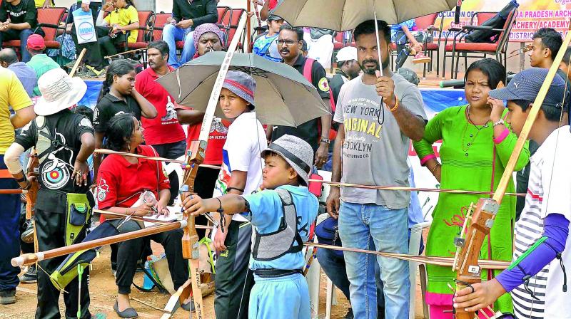 Archers take aim during the 11th mini and 3rd open kids national archery championship in Vijayawada on Thursday.  (Ch. Narayana Rao)