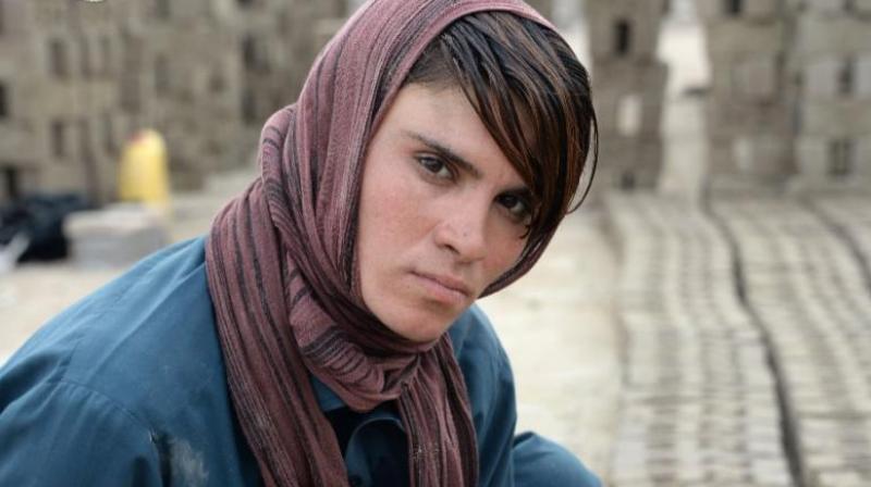 The 18-year-old, who resides with her impoverished family in a mud-brick house in a village in Afghanistans eastern province of Nangarhar, has pretended to be a boy for most of her life. (Photo: AFP)