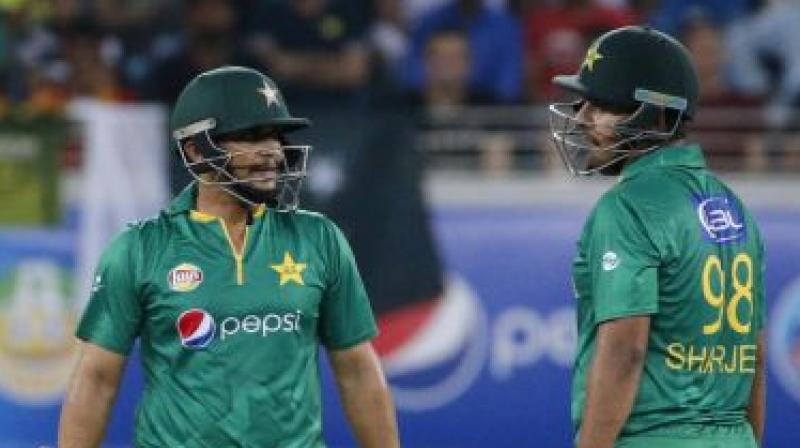 Khalid Latif (L) and Sharjeel Khan in action for Pakistan. (Photo: AFP)