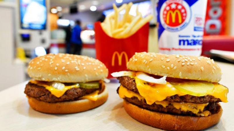 McDonalds USA on Wednesday announced that its iconic burgers, including the Big Mac and the Quarter Pounder with Cheese, no longer have artificial preservatives, artificial flavors or added colors from artificial sources. (Photo: AP)