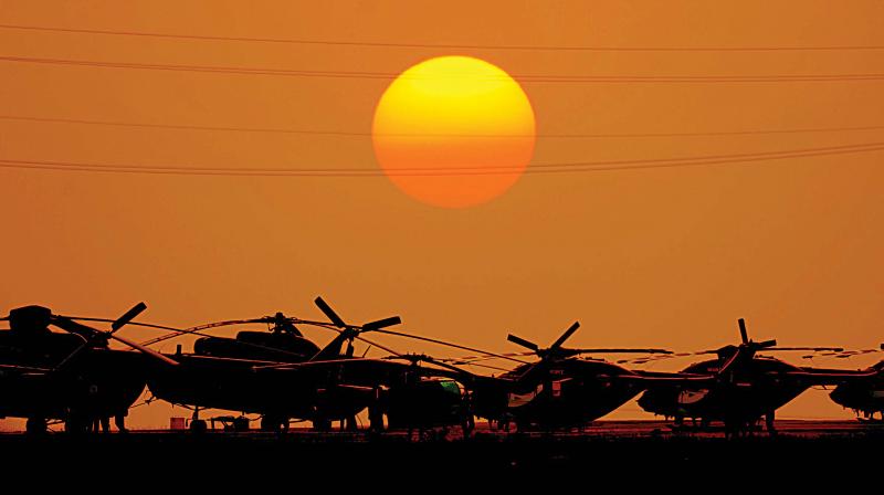 Sarang helicopters rest as the Sun sets on the last day of Aero India 2017 in Bengaluru on Saturday 	(Photo: R. Samuel)