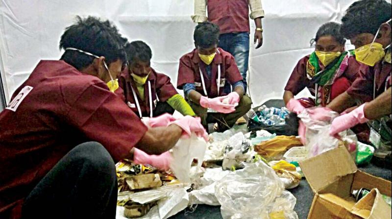 Reddonatura workers segregate waste during Aero India 2017 (Photo: DC)