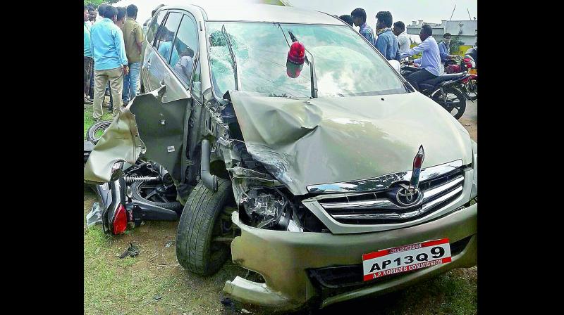 The car of AP State Women Commission chairperson N. Rajakuamari seen completely damaged after it ran over a motorcyclist on Nadivelugu Road at Takkelapadu village of Guntur on Friday. (Photo: DC)