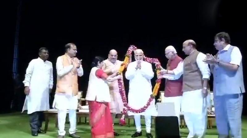 The meeting also saw top party leaders, including Union ministers Nitin Gadkari and Sushma Swaraj, besides BJP president Amit Shah felicitating the Prime Minister and also speaking on the matter. (Photo: Twitter | ANI)