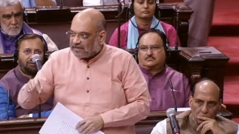 Rajiv Gandhi signed Assam accord in 1985, which was similar to NRC. They did not have courage to implement it, we did, BJP chief Amit Shah told Rajya Sabha. (Photo: Twitter | ANI)