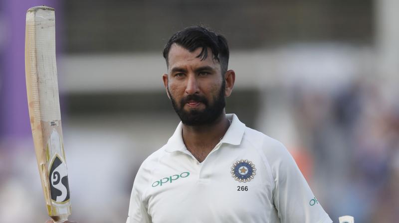 Cheteshwar Pujara scored a gritty 123 in punishing conditions to claw India back into the opening Test in Adelaide Thursday after Australia seized early control with some blistering bowling. (Photo: AP)