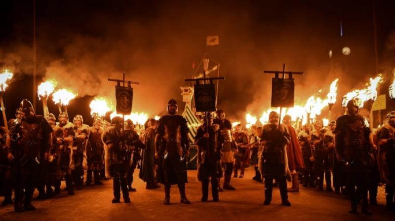 The Jarl dons the same suit of armour comprising helmet, breastplate, shield, axe, dagger and belt each year. (Photo: AFP)