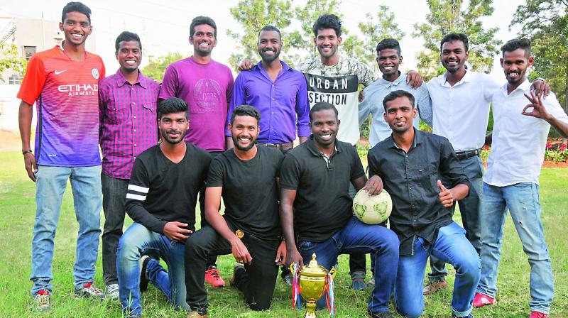 Football champions: (From left) Surya, Raghuvaran, Raghu, Emmanuel, Sri Kumar, Robin, Joshua, Anuj, (Bottom row) Akshay, Rahul, Franklin and Raja