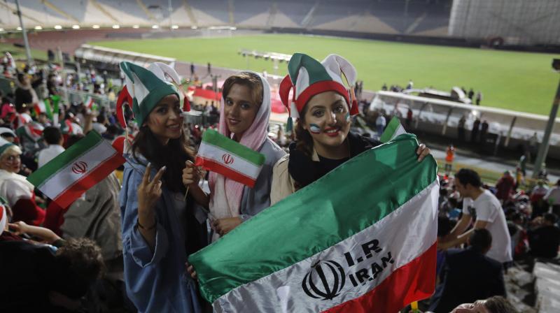 It is only the second time in almost 40 years that Iranian women have been able to watch football in Tehrans Azadi stadium, Irans biggest with 120,000 seats. (Photo: AFP)