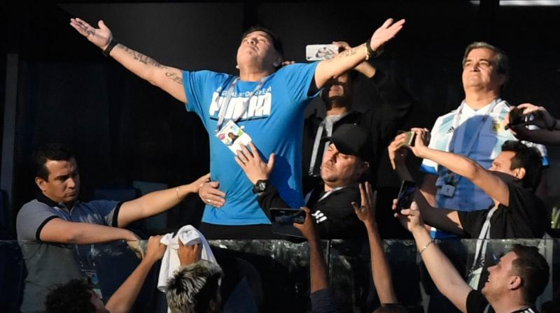 Throughout Argentinas nerve-shredding 2-1 victory, which secured the South American giants passage into the last 16, the host broadcaster television feed regularly cut to images of Maradona as the tension mounted. (Photo: AFP)