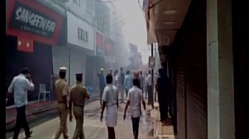 The fire broke out in a textile shop around 11:30 am. (Photo: ANI Twitter)