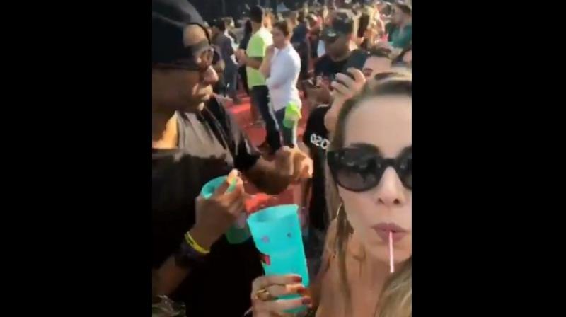 Selfie video catches man spiking womans drink (Photo Credit:  Video screengrab - Twitter / Jaeda_sky)