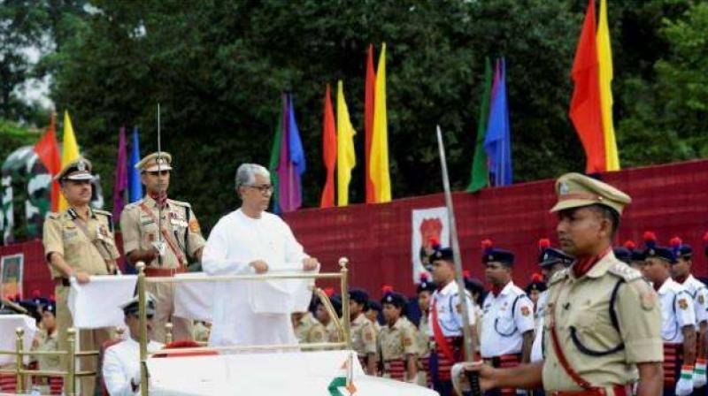 Tripura Chief Minister Manik Sarkar inspects 71st Independence Day parade in Agartala on Tuesday. (Photo: PTI)