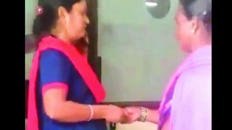 A video grab of a security guard accepting a bribe  from an attendant of a patient at the government maternity hospital in Petlaburj.