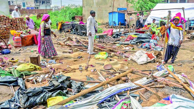 People salvage their households after Wednesday nights massive storm, near Bharatpur district of Rajasthan on Thursday. (Photo: PTI )