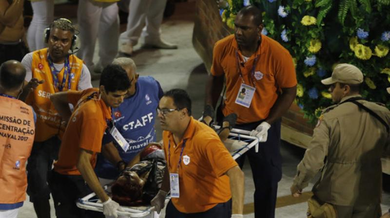 An injured person is carried on a stretcher to an ambulance during the performing of the Unidos da Tijuca samba school for the Carnival celebrations at the Sambadrome in Rio de Janeiro, Brazil, Tuesday, Feb. 28, 2017. (Photo: AP)