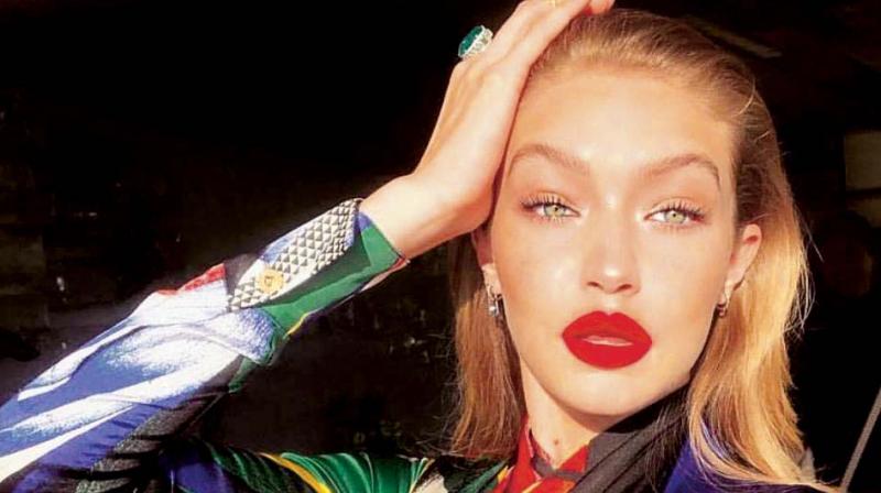 Gigi Hadid emulating the popular migraine pose, which she shared on Instragram