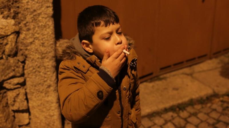 Nobody is sure what it symbolizes or exactly why parents buy the packs of cigarettes for their children (Photo: AP)