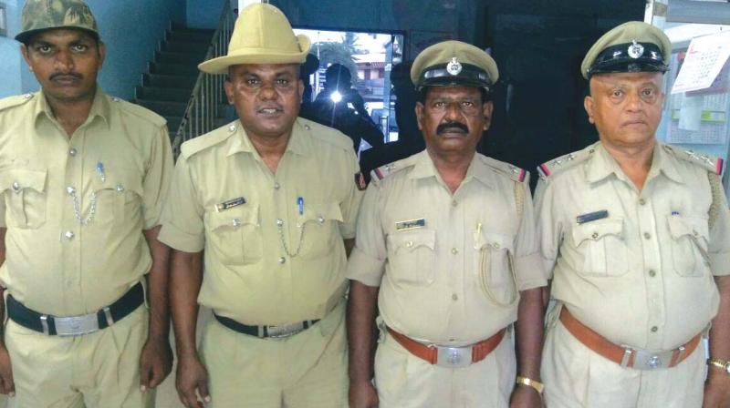 Sub-Inspector Nanjundaswamy, ASI Eshwar, Head Constable Kiran and Constable Lokesh of Kengeri Station 	(Photo:DC)